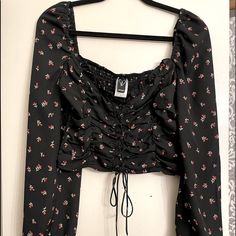 Beautiful Maiden Lace Up Blouse . Black Long Sleeve With Flower Pattern . Size Medium Cropped ,Low Square Neck And Stretchy Back .Never Worn. Practically New !!!! So Pretty Floral Print Crop Top For Fall, Casual Floral Print Crop Top Blouse, Black Floral Print Tops For Fall, Black Floral Print Crop Top, Black Floral Print Blouse For Fall, Black Crop Top Blouse For Spring, Floral Print Crop Top Blouse For Day Out, Floral Crop Top Blouse For Day Out, Black Spring Blouse For Brunch