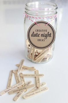 a jar filled with wooden clothes pins next to a tag that says pretty date night