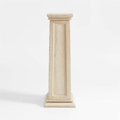 a tall wooden pillar on a white background with no people around it or in the photo