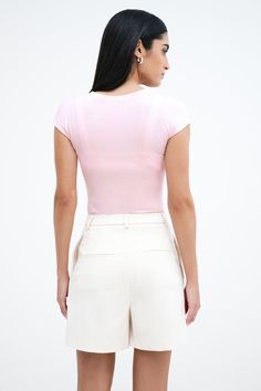 Our Kiana Top makes everyday dressing feel unique and edgy. She's a classic square neck but diagonal seams extend to separate her cap sleeves for visual interest. Her soft, high-stretch and sustainable European jersey and hugging fit provide all-day/all-night comfort. Kiana’s pink colorway is double-layered in front for extra coverage.[SPLIT] Astrid, in black, is 5'9" (175 cm) tall, wearing size XS. Sam, in pink, is 5'8" (173 cm) tall, wearing size XS. Total length is approximately 23" (58 cm). Modern Stretch Tops With Square Neck, Modern Fitted Top With Square Neck, Modern Fitted Tops With Square Neck, Modern Fitted Square Neck Top, Fitted Square Neck Top, Chic Fitted Tops With Cap Sleeve, Chic Fitted Cap Sleeve Tops, Modern Seamless Fitted Tops, Pink Fitted Square Neck Top