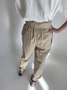 High waisted trousers with wide belted waist. Pin tuck details and gathering at waist. Short style. Model is in MINUSEY ONE SIZE. ✔️ Free worldwide express shipping over $100✔️ Loved by 6,500+ customers✔️ Limited edition collections, maximum style⠀⠀⠀⠀⠀⠀⠀⠀⠀Stay ahead of the trend with can’t-find-anywhere-else staples. Your closet will thank you 💕* MINUSEY ONE SIZE = EU 34-38, US 2-6* 100% Cotton* Dry clean* Made in Korea - Model Height: 172cm/5'7" (US2, EU34) Fitted Paperbag Waist Pants For Workwear, Fitted Bottoms With Paperbag Waist For Workwear, Fitted Paperbag Waist Bottoms For Workwear, Summer Workwear Pants With Belt Detail, Chic Belted Paperbag Waist Pants, Chic Paperbag Waist Pants With Belt Loops, Fitted Paperbag Waist Pants With Belt Loops, Relaxed Fit High Waist Bottoms With Pleated Waist, Relaxed Fit Bottoms With Paperbag Waist And Belt Loops