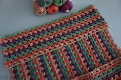 two crocheted granny afghans next to each other