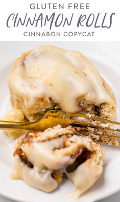 a white plate topped with cinnamon rolls covered in glaze and icing next to a fork