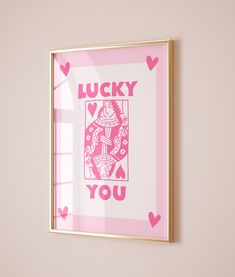 a pink and gold framed art print with the words lucky you on it's side