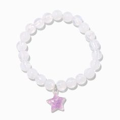 Give your day a glittery star with this stretch bracelet. It has white beads and a purple glittery star charm that glows in the dark. For best results, expose the glow-in-the-dark charm to light. Fit: Stretch Material: Plastic - Claire's Purple Star Glow in the Dark White Stretch Beaded Bracelet White Charm Bracelet With Star Charm As Gift, Adjustable White Star Charm Bracelet, White Luminous Beaded Bracelets For Gifts, Adjustable White Charm Bracelet With Star Charm, Adjustable White Luminous Beaded Bracelets, Star Glow In The Dark, Dark White, Fashionable Jewelry, Star Charms