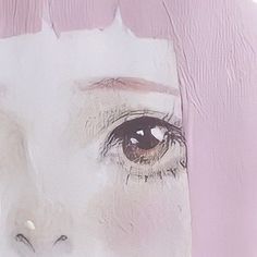 a woman's eye is painted on the side of a pink and white wall