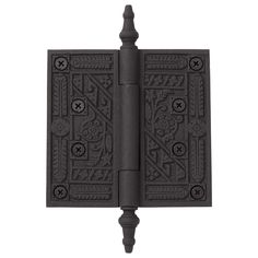 an iron door hinge with decorative designs on the front and back sides, set against a white background