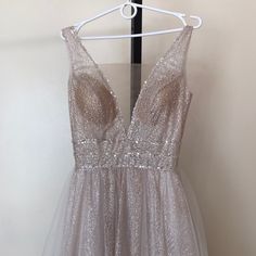 a dress hanging up on a hanger