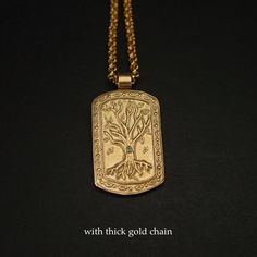 "This tree of life necklace is hand carved and shaped into a military dog tag which makes it perfect for a husband gift and unique for a nature lover. The tree of knowledge, connecting to heaven and the underworld, and the tree of life, connecting all forms of creation, are both forms of the world tree or cosmic tree, and are portrayed in various religions and philosophies as the same tree. - Hand sculpted pendant - Solid yellow bronze also called jeweler gold bronze. - Embedded 2 mm natural per Spiritual Engraved Dog Tag Jewelry, Symbolic Engraved Dog Tag Necklace, Symbolic Engraved Dog Tag Jewelry, Gold Laser Engraved Dog Tag Jewelry, The Tree Of Knowledge, Military Dog Tag, Tree Of Knowledge, Military Dog, Dog Tags Military