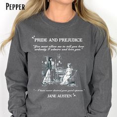 This beautiful Pride and Prejudice Shirt is inspired by one of literature's most cherished love stories. Embrace the timeless allure of Jane Austen's unforgettable characters with this vintage design and heart-stopping quote that captures the moment Darcy vows his ardent love for Elizabeth!  The essence of their passionate and complex romance is depicted in delicate detail making this shirt a must-have for any avid Austen fan! Celebrate the intricacies of love with an homage to Pride and Prejudice Shirt and display your adoration for Austen's literary masterpiece. Comfort Colors®  shirts are made with 100% ring-spun cotton and packed with softness and style. Each tee features garment-dyed fabric and has a relaxed fit for total comfort and style. .:100% ring-spun cotton .: Medium fabric (6. Literary Long Sleeve Cotton Tops, Literary Long Sleeve Tops With Letter Print, Jane Austen Shirts, Pride And Prejudice Quotes, Most Ardently, Love Stories, Pride And Prejudice, Delicate Details, Dyed Fabric