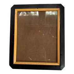 an old photo frame with holes in it