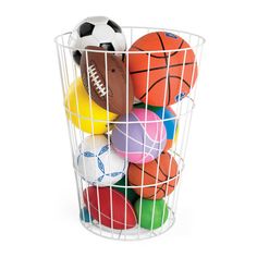 a basket filled with different colored balls and a soccer ball on the inside of it