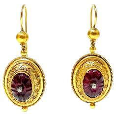 A fine example of Etruscan Revival work featuring a carved hollow-back garnet set with a tiny diamond on each earring. 2" long, 3/4" wide Circa 1870's-1880's Tiny Diamond, Garnet, Jewelry Earrings Dangle, 19th Century, Dangle Earrings, Jewelry Earrings, Carving, Gold