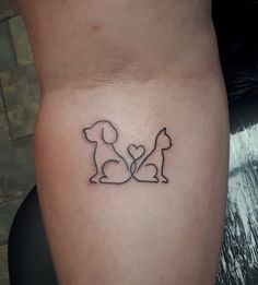 a small dog and cat tattoo on the leg