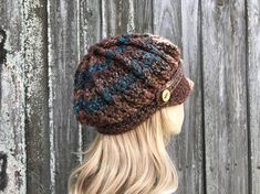 "Style: Chunky newsboy hat. It features a sturdy brim and a strap and handmade wooden buttons. Color: This sample hat is shown in Chocolate Peacock, shades from brown to rust and teal blue. Note: The coloration of these hats come out a little different every time, due to the striped nature of the yarn. If you would like photos of the exact hat that I make for you, feel free to ask, I will be happy to provide them. Sizes: One size fits 20\" to 23\" (50.5 cm to 58 cm) head size. Fiber Content: 100 Cap Crochet, Bonnet Au Crochet, Baker Boy Hat, Pixie Hat, Bonnet Crochet, Handmade Knitwear, Womens Hat, Boho Hat, Newsboy Hat