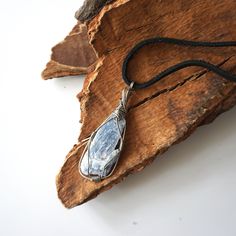 Rustic blue kyanite pendant: Tin plated copper wire wrapped setting with the raw kyanite's blue and white forms a large raw stone pendant that fits your bold style. You choose the exact kyanite we set. After ordering, you receive a picture sent with three raw kyanites. Kyanite's energy helps you with clear thinking and communication. It is also believed to enhance loyalty through increasing understanding. The necklace comes with a 24" chain or cord of your choice. Feel free to leave a message if Blue Kyanite Crystal, Kyanite Crystal, Clear Thinking, Rustic Blue, Healing Crystal Jewelry, Blue Kyanite, Raw Stone, Stone Pendant, Bold Fashion