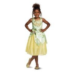 Disney Princess Dress up your kids in your favorite style and be ready to freeze everyone's attention when you walk into the party with this kids costume. Make them look super cute when they wear this classic costume. Tiana classic girl child Halloween costume Features one piece dress with shoulder straps Greenish top and skirt is yellow Costume goes below the knees Comes with bow on the waist with character cameo in center. Color: Green. Princess Tiana Costume, Princess Tiana Dress, Tiana Costume, Tiana Dress, Lay Lay, Toddler Costumes Girl, Disney Princess Costumes, Disney Princess Tiana, Classic Halloween Costumes