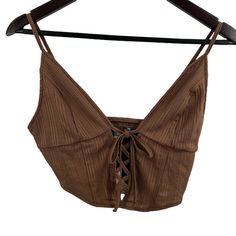 Urban Outfitters Brown Lace Front Cropped Top Size Medium. Pull On Style Lace Up Front - Laces Are Sewn In Place Ribbed Texture New With Tags Armpit To Armpit 15" Length 15" Spring V-neck Crop Top With Straps, Brown Cropped Summer Top, Brown Cami Top For Spring, Brown Crop Top For Vacation, Brown Cami Crop Top For Summer, Summer Brown Cami Crop Top, Brown V-neck Crop Top For Spring, Brown Sleeveless Crop Top For Vacation, Brown Fitted Crop Top For Vacation