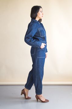 The Blanca Flight Suit is a semi-fitted, highly customizable boiler suit pattern inspired by vintage workwear. With multiple sleeve and leg options, it can be made in a variety of fabrics and can easily be styled up or down. Blanca features a center front zipper, patch pockets that double as belt loops, an optional tie belt or buckled belt, a traditional shirt collar and a unique pleated back design. Customize your flight suit by adding a long sleeve, tapered sleeve with a snap button, or short Coveralls Pattern, Boiler Suit Pattern, Coverall Pattern, Closet Core Patterns, Suit Sewing Patterns, Flight Suit, Fabric Sewing Patterns, Suit Pattern, Vintage Workwear