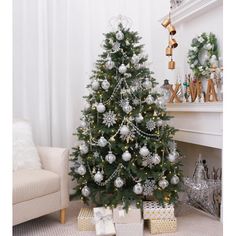 a decorated christmas tree in a living room with presents on the floor next to it