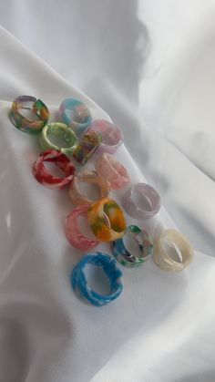 the best rings that will suit any outfit this summer! these colour mixed rings will add to are a must🥰 resin open backed rings but will not stretch to more sizes, please check the size chart in the last picture to double check your size before purchase🚨 + only £1 delivery Trendy Open Ring For Summer, Trendy White Rings For Summer, Green Plastic Summer Jewelry, Casual Adjustable Rings For Summer, Handmade Blue Ring For Summer, Green Rings For Summer Gifts, Green Rings As Summer Gift, Green Rings Suitable For Summer Gifts, Handmade White Rings For Summer