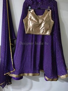 This is a made to order Lehenga Choli dupatta. I make it exclusively for my customers by using designer fabrics.I will only make it after you confirm your required size details.Handling time, don't worry, just tell me, I will process it accordingly and deliver on or before a delivery date you mention.Blouse is made with soft shimmer fabric.Dupatta is in chiffon with gold dots all over.The skirt or Lehenga is made with purple Georgette fabric with golden foil dots all over. Reception Georgette Skirt Set With Unstitched Blouse, Sheer Dupatta Georgette Long Skirt Set, Georgette Lehenga With Dupatta, Navratri Long Skirt Choli In Georgette, Navratri Georgette Choli With Long Skirt, Bollywood Style Chiffon Anarkali Set For Festive Occasions, Fitted Chiffon Lehenga For Party, Festive Georgette Lehenga Long Skirt, Georgette Long Skirt Sets For Navratri