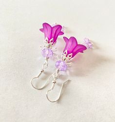 These Amethyst flower Earrings are uniquely elegant, flattering and sure to turn heads, they would look stylish for a night on the town and equally great with jeans and a t-shirt. They are made of dainty purple lucite flowers and sparkling Swarovski crystals.  🌺 These pretty vintage inspired earrings can be bought as individual pieces or as an earring / pendant set if you wish.  The matching pendant is added to a simple silver tone chain and either 16'' or 18'' can be chosen at checkout.   🌺 T Earring Pendant Set, Amethyst Flower, Vintage Inspired Earrings, Earrings Purple, Purple Earrings, Amethyst Earrings, Boho Vintage, Purple Flower, Earrings Boho