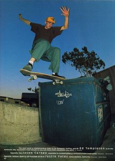 a man on a skateboard jumping over a trash can