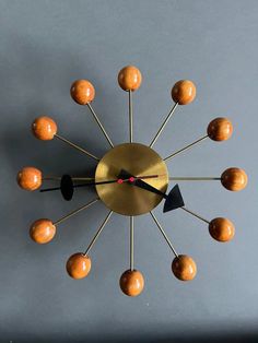 a clock that has some balls on it