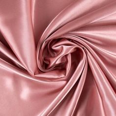 Add an element of elegance to your sewing creations with Dusty Rose Poly Satin Fabric! Featuring a light pink color and a sleek top surface, this fabric is fit for a wide range of creations. This simply stunning satin will make you shine with sophisticated style! Details: 	 Width: 58" 	 Weight: Very Lightweight 	 Country Of Origin: China 	 Content: 100% Polyester 	 Care: Machine Wash, Warm; Delicate Cycle; Tumble Dry, Low; Use Cool Iron. Do Not Bleach. 	 Flammability Note: Not For Sleepwear Avai Bath Inspiration, Dusty Rose Color, Wedding Color Palette, Light Pink Color, Satin Color, Wedding Mood Board, Wedding Mood, Pink Silk, Rose Color