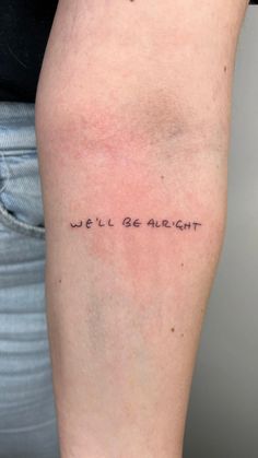 a person with a tattoo on their leg that says, we'll be alright