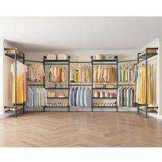 an open closet with clothes and other items on the shelves in front of it, along with wooden flooring