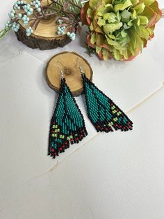 Beautiful green butterfly earrings made of shiny beads  Made from Czech beads Length 3.7inch (9.5cm) Width 1.2 '' (3cm) Hypoallergenic clasp. If you want these earrings in a different color, write to me and I will be happy to make them for you. >Back to my shop: https://www.etsy.com/shop/jewelrybylarisa?ref=seller-platform-mcnav Green Beaded Earrings With Round Beads, Green Bohemian Butterfly Jewelry, Bohemian Green Butterfly Jewelry, Beaded Butterfly Earrings, Shiny Earrings, Green Butterfly, Earrings Beaded, Earrings Green, Earrings Drop