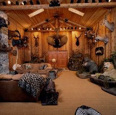 a living room filled with lots of animal heads