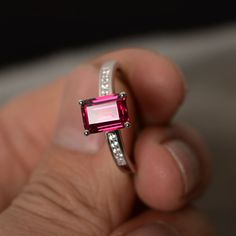 This is a gorgeous handmade creation. Its beauty is its simplicity & Elegance. The 6*8mm emerald cut lab ruby stone is crafted in solid sterling silver and with rhodium plated. It's made to order and it will take about 7-10 days to make it. All item is sent in a beautiful gift box You can realize more lovely stuff clicking the link https://www.etsy.com/shop/knightjewelry?refshopsection_shophome_leftnav Please leave the correct address and you phone number for delivering successfully. Red Gemstone Ring, July Birthstone Ring, Ruby Engagement Ring, Birthday Ring, Red Gemstones, July Birthstone, Anniversary Gift For Her, Diamond Solitaire Engagement Ring, Ruby Ring