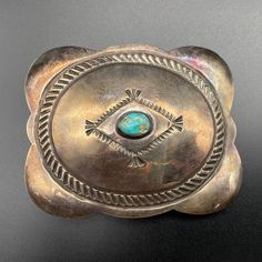 Vintage Navajo Native Turquoise Hand Stamp Work Silver Belt Buckle 1-1/8". Would fit a belt of up to 1-1/8". Stone chipped. ---------------------------------------- All items, unless stated otherwise, are previously loved and used, showing scratches and slight imperfections (not brand new). Please refer to pictures for condition as they depict what you'll receive. If you have any questions, ask before purchasing. Note:   - Size and weight are approximate.   - "Vintage" is based on look and feel; items may be older (pre-1930s) or newer (post-1980s/1990s).   - We're not experts on stones. Refer to pictures for type and quality.   - "Southwestern" items reflect that style, possibly from Navajo, Zuni, Hopi, etc.   - "Sterling" items are tested to be at least coin (90%) silver. No returns on in Southwestern Turquoise Concho Belt Buckles, Silver Belt Buckle, Silver Belt, Stone Chips, Silver Belts, Vintage Navajo, Suspender Belt, Belt Buckle, Belt Buckles