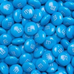 blue candies with white letters on them