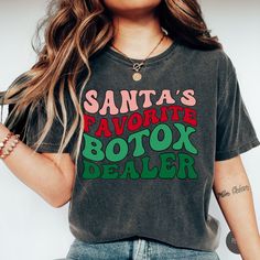 "💉 Get ready to be \"Santa's Favorite\" in our Botox-themed holiday attire with our Santa's Favorite Botox Dealer Christmas Comfort Color Shirt! This unique shirt is tailor-made for nurse injectors, cosmetic nurses, and anyone who loves aesthetics and the festive season. Whether you're a Botox dealer or searching for the perfect Botox gift, this shirt is the ideal choice. Check out our holiday Botox collection here: https://www.etsy.com/shop/HappyHumansDesign?ref=seller-platform-mcnav&search_query=botox+christmas 💉 SPECS: * Gildan Comfort Colors 1717, very durable and comfy * UNISEX sizing * 100% Garment-dyed ringspun cotton * Pre-shrunk * Double-needle armhole, sleeve and bottom hems * 7/8\" double-needle topstitched collar * Signature twill label * Twill taped neck and shoulders for ex Esthetician Clothes, Cosmetic Nurse, Favorite Aesthetic, Aesthetic Nurse, Nurse Injector, Skin Facts, Nurse Aesthetic, Facial Aesthetics, Holiday Attire