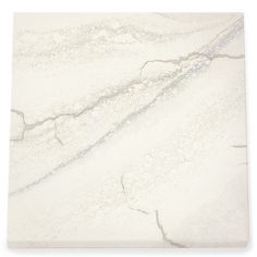 a white marble tile with grey veining on the bottom and sides, in an irregular pattern