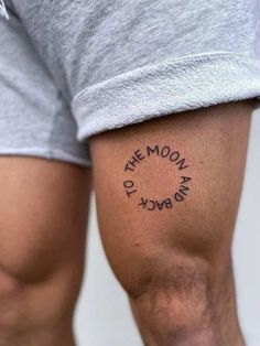 a man with a tattoo on his arm that says the moon is in black ink