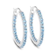 "Swiss Blue Topaz Earrings, Genuine Swiss Blue Topaz Hoop Silver Earrings for Women, December Birthstone Earrings, Blue Gemstone Earrings Product Details:  .925 Sterling Silver Stone Details: Swiss Blue Topaz Item Type: Earrings Subcategory: Blue Topaz Gross Wt: 5.56 Gemstone Wt: 1.73 ctw Total Stone Wt: 1.73 ctw Finish: Rhodium Plated Product Style: Hoop Earrings Back Finding: Catches Total Qty Of Stones: 48 Height: 3.56 MM Width: 2.54 MM Length: 25.15 MM Primary Stone Color: Blue Birthstone Mo Blue Round Hoop Earrings For Anniversary, Blue Cubic Zirconia Hoop Earrings, Blue Hoop Earrings With Prong Setting, Blue Cubic Zirconia Hoop Earrings For Anniversary, Blue Cubic Zirconia Hoop Jewelry, Blue Sterling Silver Hoop Earrings With Prong Setting, Blue Gemstone Hoop Earrings, Fine Jewelry Blue Hoop Earrings, Blue Hoop Earrings Fine Jewelry