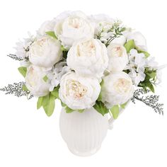 a white vase filled with lots of white flowers