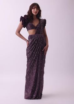 📌Hey! Please message us if you have any questions. We'll definitely assist you. The Designer Wine Purple Pre Stitched Pearl and Sequins With Embroidered Saree and Blouse Set is an exquisite outfit that offers a blend of elegance and glamour. Here's a detailed description of the ensemble: Saree:- Color: Wine Purple Style: Pre-stitched Embellishments: The saree features intricate embroidery adorned with pearls and sequins. These embellishments add a touch of luxury and sparkle to the outfit. Draping Style: As a pre-stitched saree, it's designed to be easy to drape, making it convenient to wear while maintaining the traditional saree aesthetic. Blouse: Color:- Wine Purple (Matching the saree) Embellishments: The blouse is adorned with similar pearl and sequin embroidery as the saree, ensurin Flower Sleeves, Shimmer Saree, Freshers Party, Saree And Blouse, Wine Purple, Classic Updo, Formal Parties, Flower Sleeve, Modern Saree