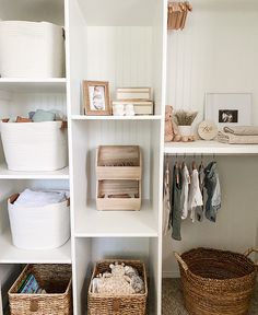 an organized closet with baskets and clothes