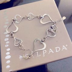 Silpada Spread Love Bracelet! Features 925 sterling silver linked hearts with a lobster clasp. Necklace is 7 1/2 inches in length. It can be found in the 2012-2013 catalog page 26C. Vintage item before silver went so high. Its solid silver! Display item in Excellent Condition! Super cute. Items will be sent in a gift bag with an anti tarnish strip. combined shipping is available SAVE ME AS YOUR FAVORITE SELLER! IM A FORMER REP AND HAVE HUNDREDS OF SILPADA ITEMS YET TO BE LISTED! MESSAGE ME IF YO Silver Heart Bracelet With Sterling Clasp For Valentine's Day, Elegant Nickel-free Heart Bracelet For Mother's Day, Elegant Nickel Free Heart Bracelet For Mother's Day, Silver Heart Bracelet With Sterling Silver Clasp, Elegant Nickel-free Heart Bracelet For Valentine's Day, Valentine's Day Sterling Silver Bracelet, Nickel-free Silver Heart Bracelet For Anniversary, Silver Heart Bracelet With Lobster Clasp In Sterling Silver, Nickel-free Sterling Silver Heart Bracelet