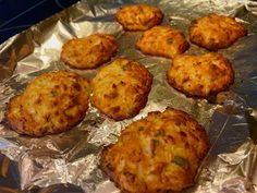 some food is sitting on top of tin foil and ready to be cooked in the oven