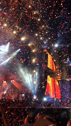 confetti is thrown in the air at a concert