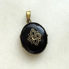 "This is a vintage gold filled oval picture locket.  There is some damage to the left side of the locket, a chip out of the enamel.  The center almost looks as if it held a stone, but there is a small cone of metal that pops up in there.  I believe it was manufactured to look like a stone.  The back of the locket has a smaller chip in the enamel, like a sliver missing.  The inside of the locket has some etch markings and enamel.  There is an antique picture on the left side that has some wear. Silver Jeep, Enamel Locket, Expensive Rings, Spiral Necklace, Picture Locket, Antique Pictures, Oval Locket, Small Boy, Heart Pendant Gold