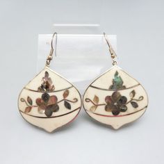 These French hook style pierced earrings are perfect for summer fashions with their silvery metal and color of white enamel and gray blue abalone shell. They are made with Alpaca metal which looks and shines like sterling but is not, and lustrous abalone shell inlaid in creamy white enamel . From the top of the hook to the bottom of the earring, they measure 2 1/2 inches long. They are 1 5/8ths inches wide and in very good condition . They are marked, ALPACA, MEXICO on the back. The work in these earrings is among the best I have seen.  It is very intricate.  We will send these to you in a lovely gift box for easy gift giving. If you like all kinds of vintage costume jewelry, old silver, rhinestones and western accessories like bolo ties, kindly check out my Etsy store at www.etsy.com/shop White Drop Earrings With French Hook, White Dangle Earrings With French Hook, White Teardrop Flower Earrings Nickel Free, White Teardrop Earrings With French Hook, White Shell Earrings For Pierced Ears, Teardrop Mother Of Pearl Earrings With Ear Wire, White Mother Of Pearl Earrings, White Teardrop Nickel-free Flower Earrings, Silver Mother Of Pearl Earrings With Ear Wire