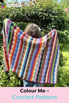 a woman is holding up a colorful blanket in the garden with text that reads, color me - crochet pattern